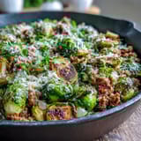 Freshly squeezed lemon juice and melted Parmesan cheese garnish this easy, one-pan Brussels Sprouts & Ground Turkey Skillet.