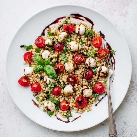 This easy Caprese Couscous Salad is a refreshing Mediterranean-inspired dish, perfect for a summer picnic or a light lunch on the patio.  