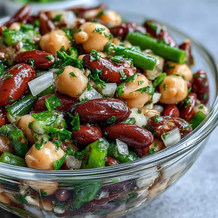 Tangy and refreshing three-bean salad ready for your next potluck gathering.
